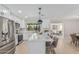 Bright, modern kitchen with white cabinets, stainless steel appliances, and marble countertops at 4416 E Capistrano Ave, Phoenix, AZ 85044