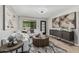 Bright living room with stylish furnishings, modern decor, and a large window at 4416 E Capistrano Ave, Phoenix, AZ 85044