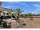 Wonderful covered backyard patio with mature foliage and desert landscaping at 4680 E Nightingale Ln, Gilbert, AZ 85298