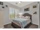 Cozy bedroom with a large window, a comfortable bed, and stylish decor at 4680 E Nightingale Ln, Gilbert, AZ 85298