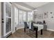 Inviting dining area with large windows, modern lighting, and stylish furniture at 4680 E Nightingale Ln, Gilbert, AZ 85298