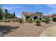 Single-story home showcasing desert landscaping, a tile roof, and a charming curb appeal in a sunny locale at 4680 E Nightingale Ln, Gilbert, AZ 85298