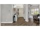 Bright and open foyer with hardwood floors, neutral walls, and a view into the living area at 4680 E Nightingale Ln, Gilbert, AZ 85298