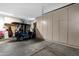 Spacious garage with plenty of storage, showcasing a golf cart and various equipment at 4680 E Nightingale Ln, Gilbert, AZ 85298
