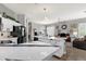 Open concept kitchen with a large island and modern countertops, flowing into the living area at 4680 E Nightingale Ln, Gilbert, AZ 85298
