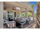 Inviting covered patio featuring comfortable seating, ceiling fans, and scenic outdoor views at 4680 E Nightingale Ln, Gilbert, AZ 85298