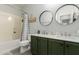 Bathroom featuring a double sink vanity, shower-tub combo, and modern fixtures at 5113 W Molly Ln, Phoenix, AZ 85083