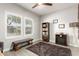 Cozy bedroom features natural light, a comfortable bench, and modern furnishings creating a relaxing retreat at 5113 W Molly Ln, Phoenix, AZ 85083
