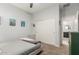 A calming bedroom featuring art on the walls and access to an ensuite bathroom at 5113 W Molly Ln, Phoenix, AZ 85083