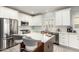 Spacious kitchen with stainless steel appliances, quartz countertops, and white cabinetry at 5113 W Molly Ln, Phoenix, AZ 85083