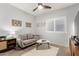 Comfortable sitting room featuring a ceiling fan and a sunlit window at 5113 W Molly Ln, Phoenix, AZ 85083