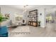 Bright living room boasts stylish furnishings, a unique bookshelf, and modern lighting for a contemporary flair at 5113 W Molly Ln, Phoenix, AZ 85083