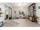 Bright living room boasts stylish furnishings, a unique bookshelf, and modern lighting for a contemporary flair at 5113 W Molly Ln, Phoenix, AZ 85083