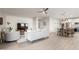 Bright and open living room with a decorative accent wall leading to the dining room and kitchen at 5113 W Molly Ln, Phoenix, AZ 85083