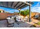 Inviting outdoor kitchen and patio area with built-in grill, comfortable seating, and stylish pergola perfect for entertaining at 5113 W Molly Ln, Phoenix, AZ 85083