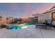 Relaxing backyard pool with rock waterfall, lounge chairs, and serene ambiance at 5113 W Molly Ln, Phoenix, AZ 85083