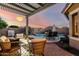 Backyard oasis featuring a sparkling pool, comfortable seating, and landscaped surroundings at 5113 W Molly Ln, Phoenix, AZ 85083