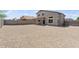 View of a spacious backyard with gravel landscaping for low maintenance at 5420 W Grove St, Laveen, AZ 85339