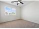 Well-lit bedroom with a ceiling fan, offering a comfortable and relaxing atmosphere at 5420 W Grove St, Laveen, AZ 85339