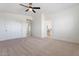 Spacious bedroom with closet and open view to ensuite bathroom allowing for a flexible layout at 5420 W Grove St, Laveen, AZ 85339