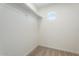 Walk-in closet with a window, providing natural light and fresh air, and a rod for hanging clothes at 5420 W Grove St, Laveen, AZ 85339