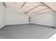 Spacious three-car garage with painted floor, offering ample parking and storage at 5420 W Grove St, Laveen, AZ 85339