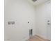 A convenient laundry room featuring hookups and a modern design at 5420 W Grove St, Laveen, AZ 85339