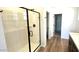 Modern bathroom featuring a glass-enclosed shower and vanity at 5657 S 253Rd Ave, Buckeye, AZ 85326