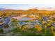 Community aerial view showcasing amenities: basketball, volleyball courts, playgrounds, and scenic mountain views at 6502 W Wahalla Ln, Glendale, AZ 85308