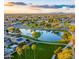 Aerial view of neighborhood lake with walking paths and community recreation areas at 6502 W Wahalla Ln, Glendale, AZ 85308