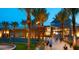 Arrowhead Towne Center mall with trees and exterior lighting at twilight at 6502 W Wahalla Ln, Glendale, AZ 85308