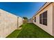 An exterior shows artificial turf and brick block fencing at 6502 W Wahalla Ln, Glendale, AZ 85308