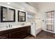 The spacious primary bathroom offers dual sinks, soaking tub, and plenty of natural light at 6502 W Wahalla Ln, Glendale, AZ 85308