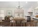 Well-lit dining area showcases a modern table setting, stylish lighting, and updated decor at 6502 W Wahalla Ln, Glendale, AZ 85308