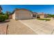 Charming single-story home featuring stucco siding, a two-car garage, and low-maintenance desert landscaping at 6502 W Wahalla Ln, Glendale, AZ 85308