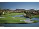 Beautiful golf course with sand traps and a water hazard at 6502 W Wahalla Ln, Glendale, AZ 85308