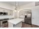 Modern kitchen with stainless steel appliances, quartz countertops, and ample cabinet space at 6502 W Wahalla Ln, Glendale, AZ 85308