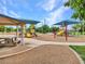 Well-equipped playground area with multiple play structures and picnic tables for community enjoyment at 6502 W Wahalla Ln, Glendale, AZ 85308