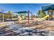 Colorful community playground with slides, swings, and covered play areas for recreation at 6502 W Wahalla Ln, Glendale, AZ 85308
