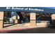Exterior shot of a school featuring the entrance with visible signage and architectural details at 6502 W Wahalla Ln, Glendale, AZ 85308