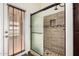 This newly updated shower has tile surround with a built-in niche at 6502 W Wahalla Ln, Glendale, AZ 85308