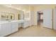 Spacious bathroom boasting a double sink vanity and tile flooring at 728 W Sandra Ter, Phoenix, AZ 85023