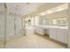 Bright bathroom featuring a walk-in shower, bathtub, and double sink vanity at 728 W Sandra Ter, Phoenix, AZ 85023