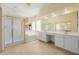 Bright bathroom featuring a walk-in shower, bathtub, and double sink vanity at 728 W Sandra Ter, Phoenix, AZ 85023
