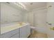 Clean, functional bathroom with white cabinets and a combined tub and shower at 728 W Sandra Ter, Phoenix, AZ 85023