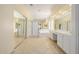 Large bathroom with glass enclosed shower, soaking tub, and double sinks at 728 W Sandra Ter, Phoenix, AZ 85023