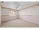 Cute bedroom with a ceiling fan, carpeted floor and a decorative border at 728 W Sandra Ter, Phoenix, AZ 85023