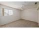 Bedroom featuring a ceiling fan, carpeted floor and a double door closet at 728 W Sandra Ter, Phoenix, AZ 85023