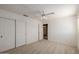 Bedroom featuring a ceiling fan, carpeted floor and a double door closet at 728 W Sandra Ter, Phoenix, AZ 85023
