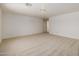 Spacious, carpeted bedroom with a view to the hallway and a simple light fixture at 728 W Sandra Ter, Phoenix, AZ 85023